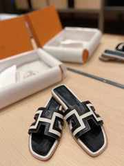 0RAN SANDALS IN BLACK CALFSKIN AND WHITE CANVAS