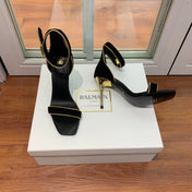 BALMAIN 25S UMA HEELED SANDALS 105MM IN BLACK SUEDE GOLD HARDWARE