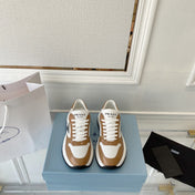 PRADA 25S THICK SOLE SNEAKER IN WHITE AND BROWN CALFSKIN