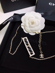 CHANEL 26S CHANEL CC LOGO CRYSTAL TRIM BAR PENDANT NECKLACE WITH BLACK LEATHER IN GOLD METAL 633315