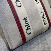 MEDIUM STRAP WOODY TOTE BAG 37 IN BEIGE LINEN CANVAS BLACK WEBBING LOGO EMBROIDER RED CALFSKIN