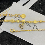 CD 26S CD LOGO CZ STATION NECKLACE IN GOLD TONE METAL 631851