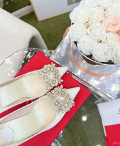 EFFLORESCENCE POINTED-TOE PUMPS IN WHITE SATIN WITH CRYSTAL BUCKLE