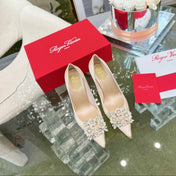 EFFLORESCENCE POINTED-TOE PUMPS IN NUDE SATIN WITH CRYSTAL BUCKLE