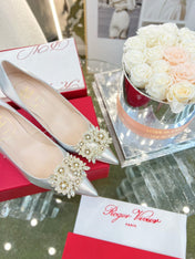 EFFLORESCENCE POINTED-TOE PUMPS 85MM IN SILVER SATIN WITH CRYSTAL BUCKLE