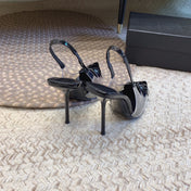 HIGH SLINGBACK IN BLACK GLOSSY CALFSKIN SPLICED WITH TPU