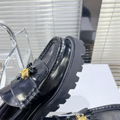 MARGARET CHUNKY LOAFER WITH FRINGES AND TRIOMPHE CHAIN IN POLISHED BULL GLOSSY BLACK