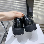 MARGARET CHUNKY LOAFER WITH FRINGES AND TRIOMPHE CHAIN IN POLISHED BULL GLOSSY BLACK