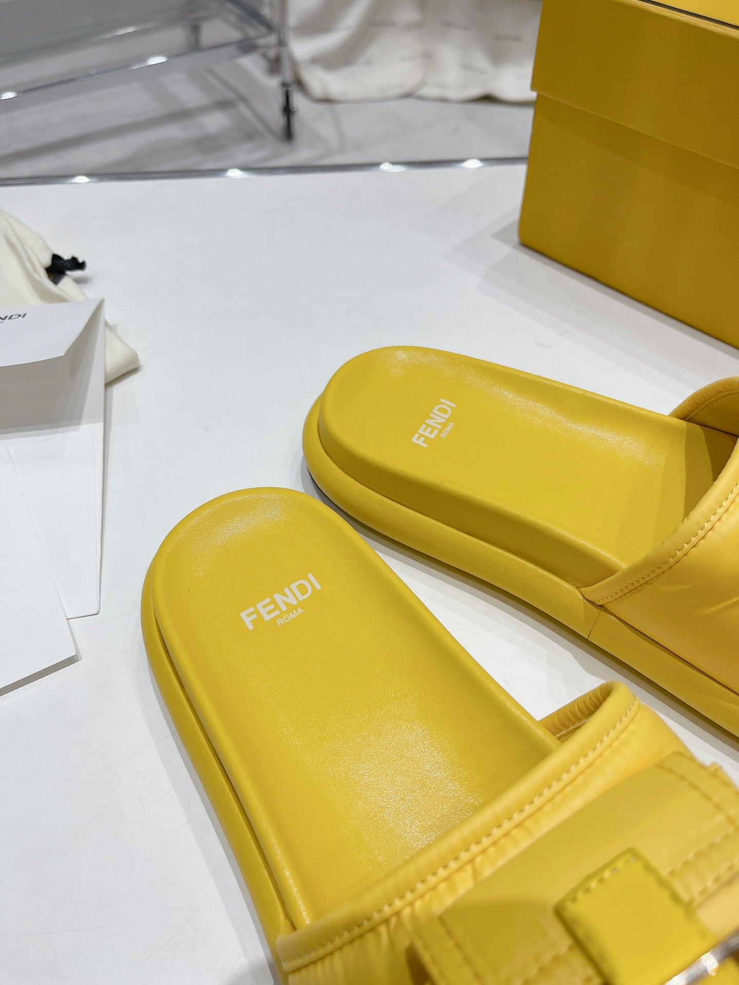 FENDI BAGUETTE SLIPPERS IN NAPLES YELLOW LAMBSKIN WITH GOLD HARDWARE