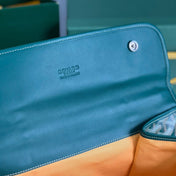 SAINT LÉGER BACKPACK 35 IN GREEN GOYARDINE CANVAS AND CALFSKIN WITH CARTOON PATCH