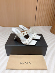 ALAIA TWO-STRAPS HIGH HEEL SANDALS IN WHITE PATENT LAMBSKIN