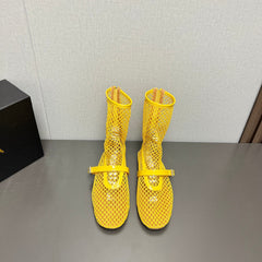 ALAIA SHORT BOOTS IN LEMON YELLOW MESH FISHNET