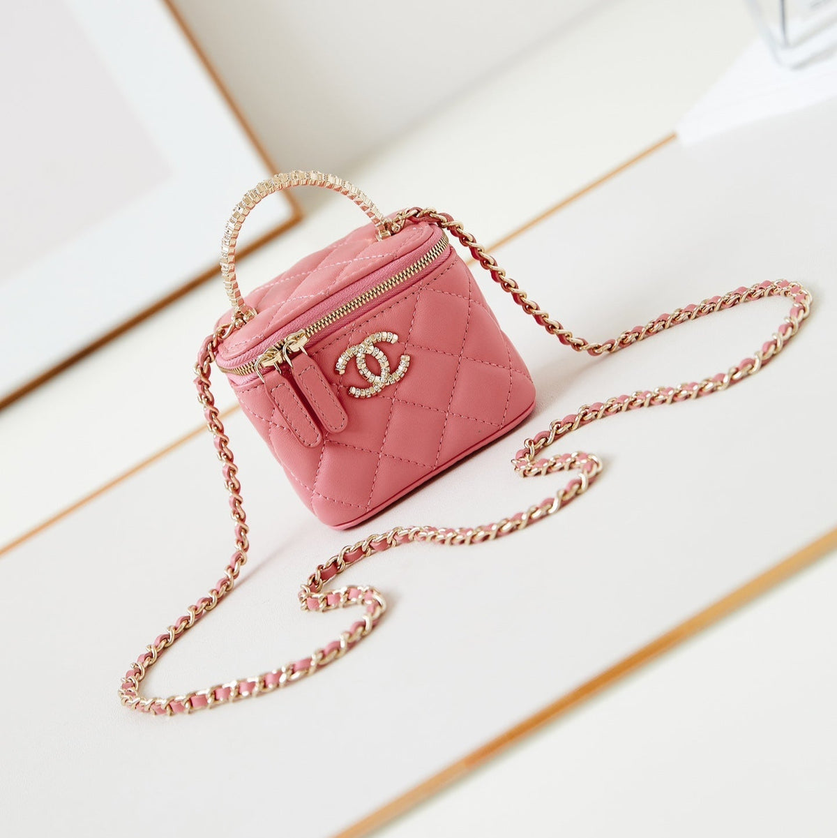 CHANEL 25S MINI VANITY BAG 11 CM IN PEACH PINK LAMBSKIN WITH CRYSTAL-EMBELLISHED CC LOGO