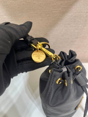 MINI BUCKET BAG 10 IN BLACK RE-NYLON AND SAFFIANO LEATHER STRAP