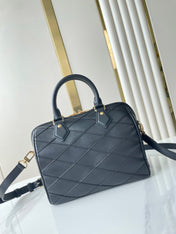 SPEEDY BANDOULIÈRE 25 WITH CRISS CROSS PATTERN IN BLACK LAMBSKIN