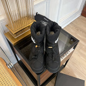 SKI BOOTS IN BLACK QUILTED COTTON