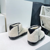 MINI ANKLE BOOT IN WHITE SHEARLING WITH BLACK ULTRA LIGHTWEIGHT RUBBER OUTSOLE