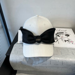 MM BASEBALL CAP IN WHITE FABRIC WITH LARGE BLACK BOW