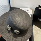 FLAT STRAW HAT BLACK FLOWER ATTACHMENT 673929