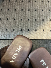 PRADA 25S SHUFFLE LEATHER THONG SANDALS IN BROWN CALFSKIN