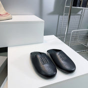 BALENCIAGA 25S MULES IN BLACK LAMBSKIN