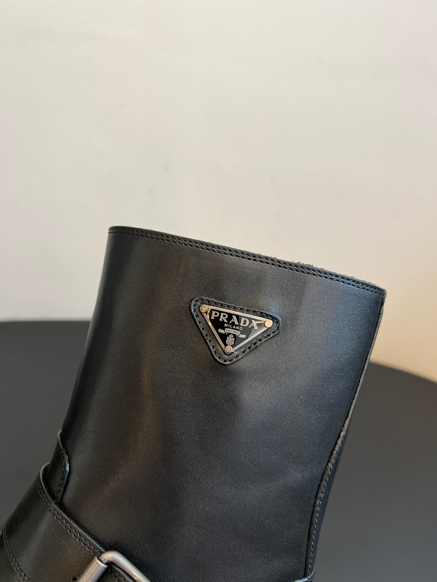 PRADA 25S PLATFORM ANKLE BOOTS IN BLACK CALFSKIN WITH SILVER HARDWARE