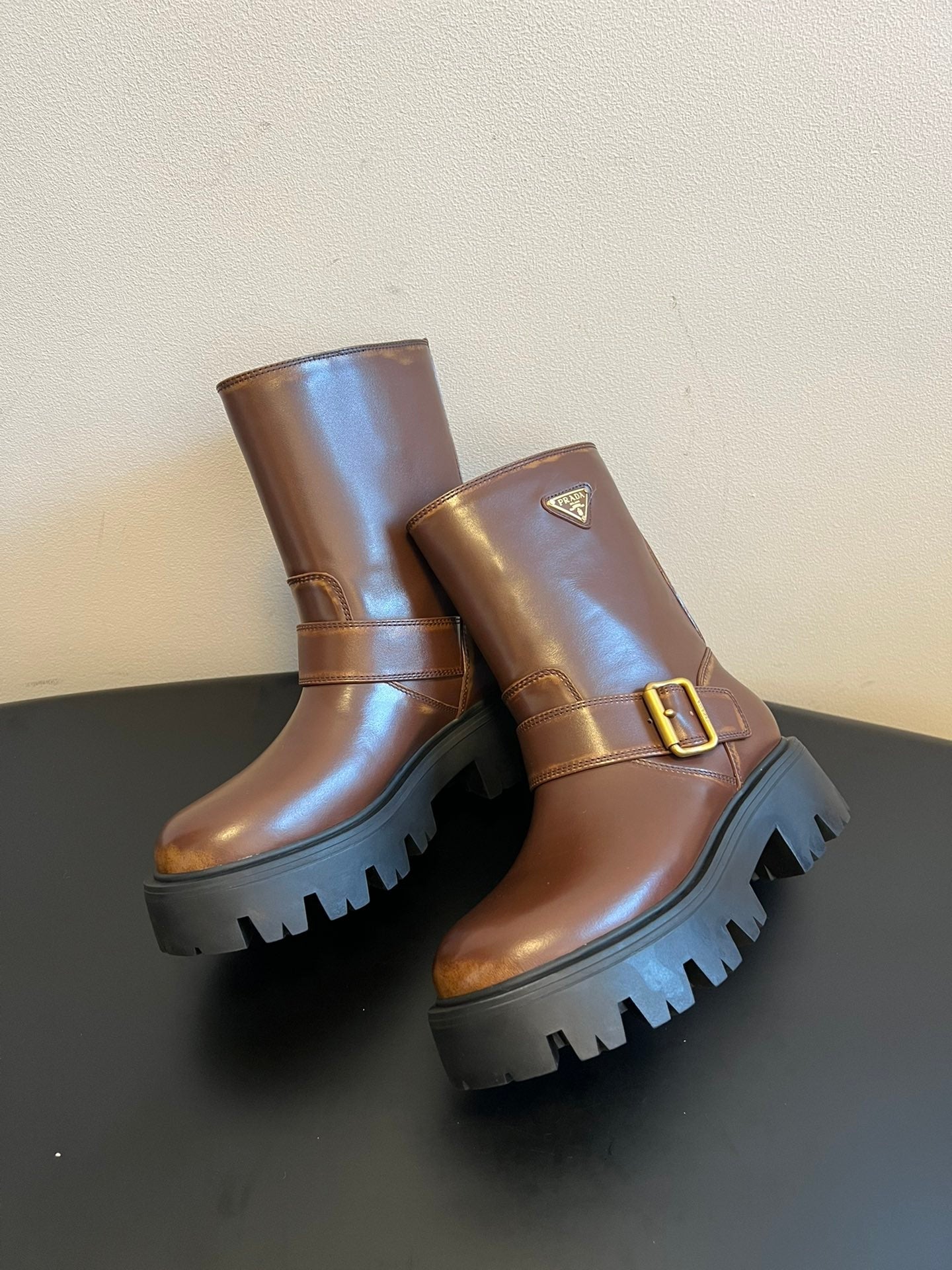 PRADA 25S PLATFORM ANKLE BOOTS IN BROWN CALFSKIN WITH GOLD HARDWARE