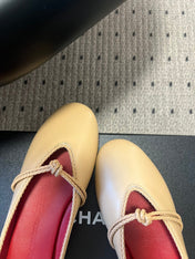 BOTTEGA VENETA 26S FLAT MULES IN BEIGE LAMBSKIN