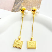 MIUMIU 26S PEARL BAR DROP LOGO EARRINGS IN GOLD TONE METAL 629846