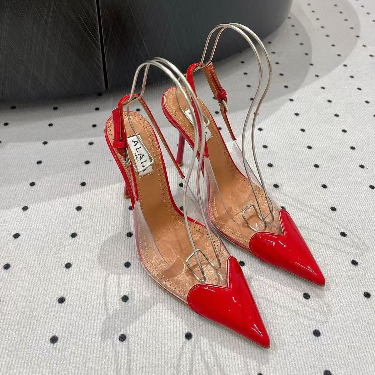 ALAIA HIGH 9 CM SLINGBACK IN CHERRY RED PATENT CALFSKIN AND FILM