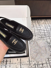 SLINGBACK LOAFER IN BLACK CALFSKIN AND SHEARLING