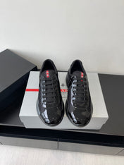 PRADA SNEAKER 25S IN BLACK MESH AND PATENT CALFSKIN