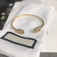 GOLD RUNNING DIAMOND LOGO BANGLE BRACELETS