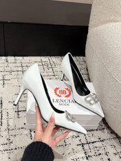 POINTED HIGH PUMPS IN WHITE PATENT CALFSKIN WITH CRYSTAL BUCKLE