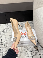 POINTED HIGH PUMPS IN LUXE BEIGE PATENT CALFSKIN WITH CRYSTAL BUCKLE