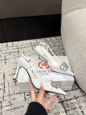 POINTED HIGH SLINGBACK IN WHITE PATENT CALFSKIN WITH CRYSTAL BUCKLE