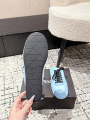 PRADA 25S DEXUN MULE IN LIGHT BLUE SUEDE LEATHER