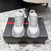 PRADA 25S MEN SNEAKERS IN GRAY AND WHITE CANVAS