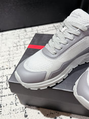 PRADA 25S MEN SNEAKERS IN GRAY AND WHITE CANVAS