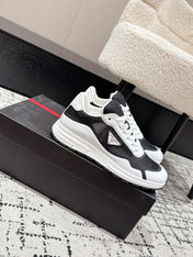 PRADA 25S MEN SNEAKERS IN BLACK AND WHITE CANVAS