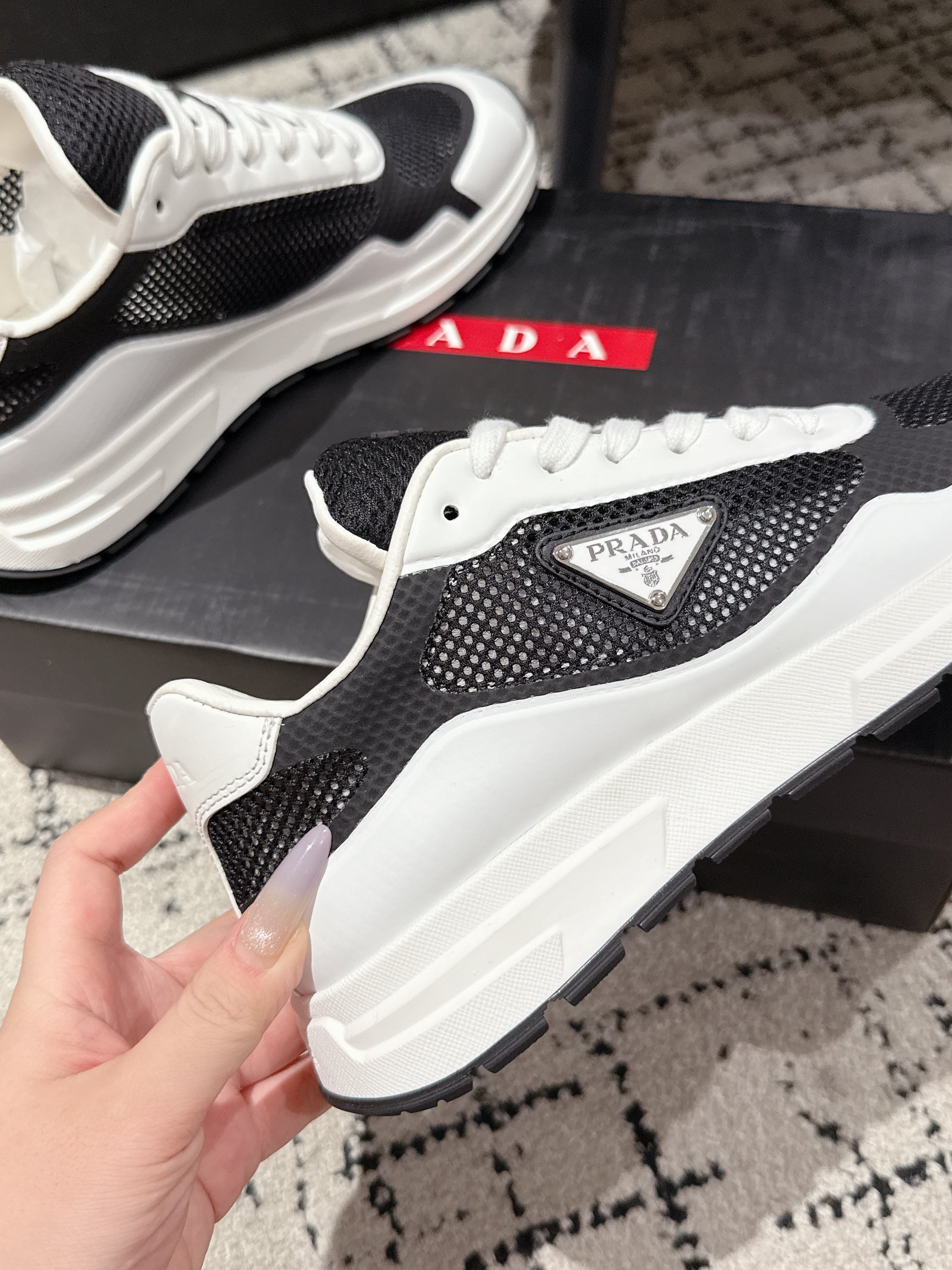 PRADA 25S MEN SNEAKERS IN BLACK AND WHITE CANVAS