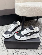 PRADA 25S MEN SNEAKERS IN BLACK AND WHITE CANVAS
