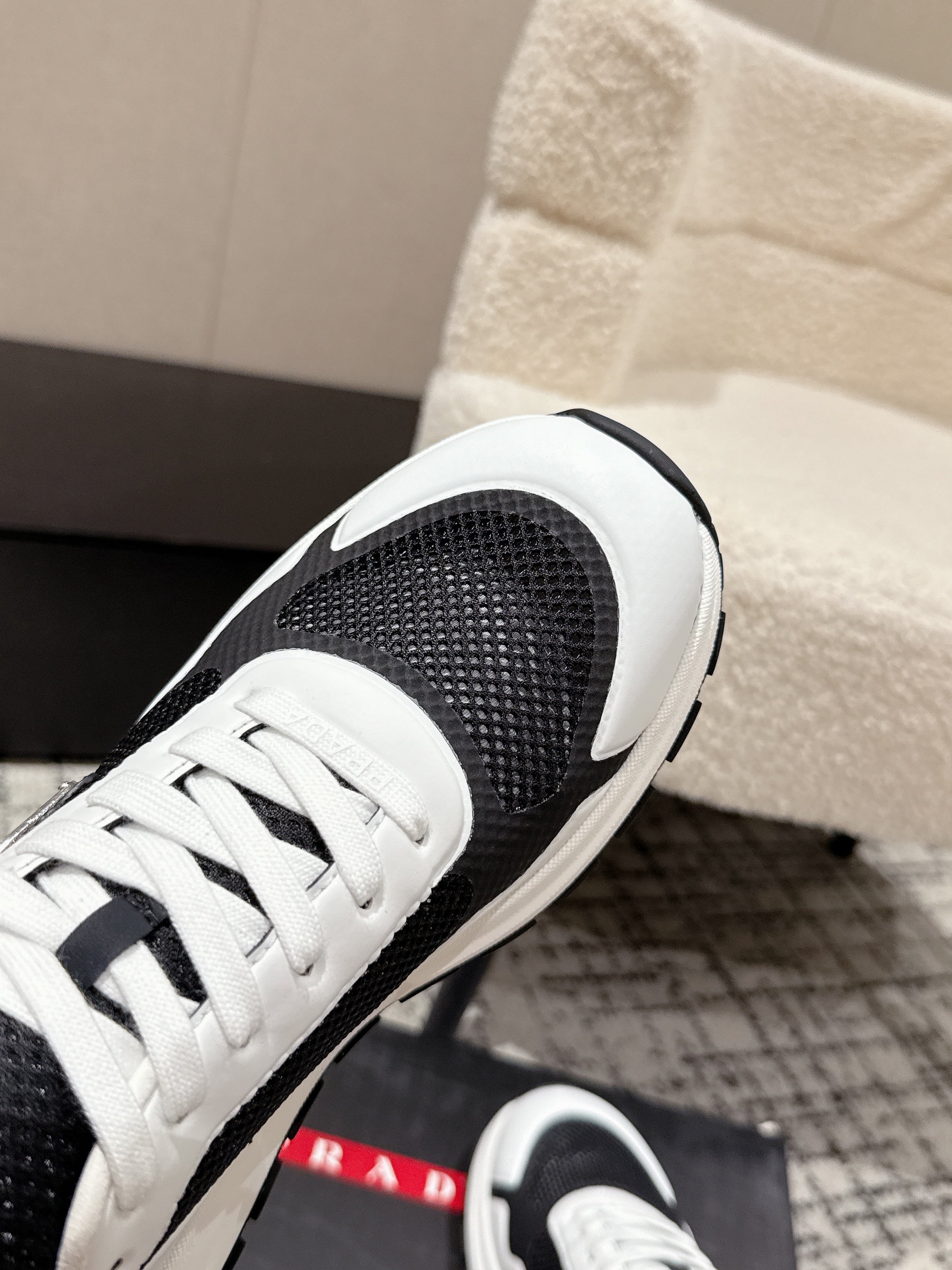 PRADA 25S MEN SNEAKERS IN BLACK AND WHITE CANVAS