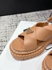 PRADA 25S CRISSCROSS SANDALS IN BURNT ORANGE CALFSKIN LOGO