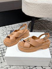 PRADA 25S CRISSCROSS SANDALS IN BURNT ORANGE CALFSKIN LOGO
