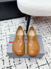 PRADA 26S SLIP ON SHOES IN WARM BROWN SMOOTH CALFSKIN