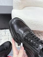PRADA 26S SNEAKERS IN BLACK SHINY CALFSKIN