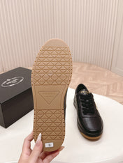 PRADA 25S DOWNTOWN SNEAKERS IN BLACK CALFSKIN