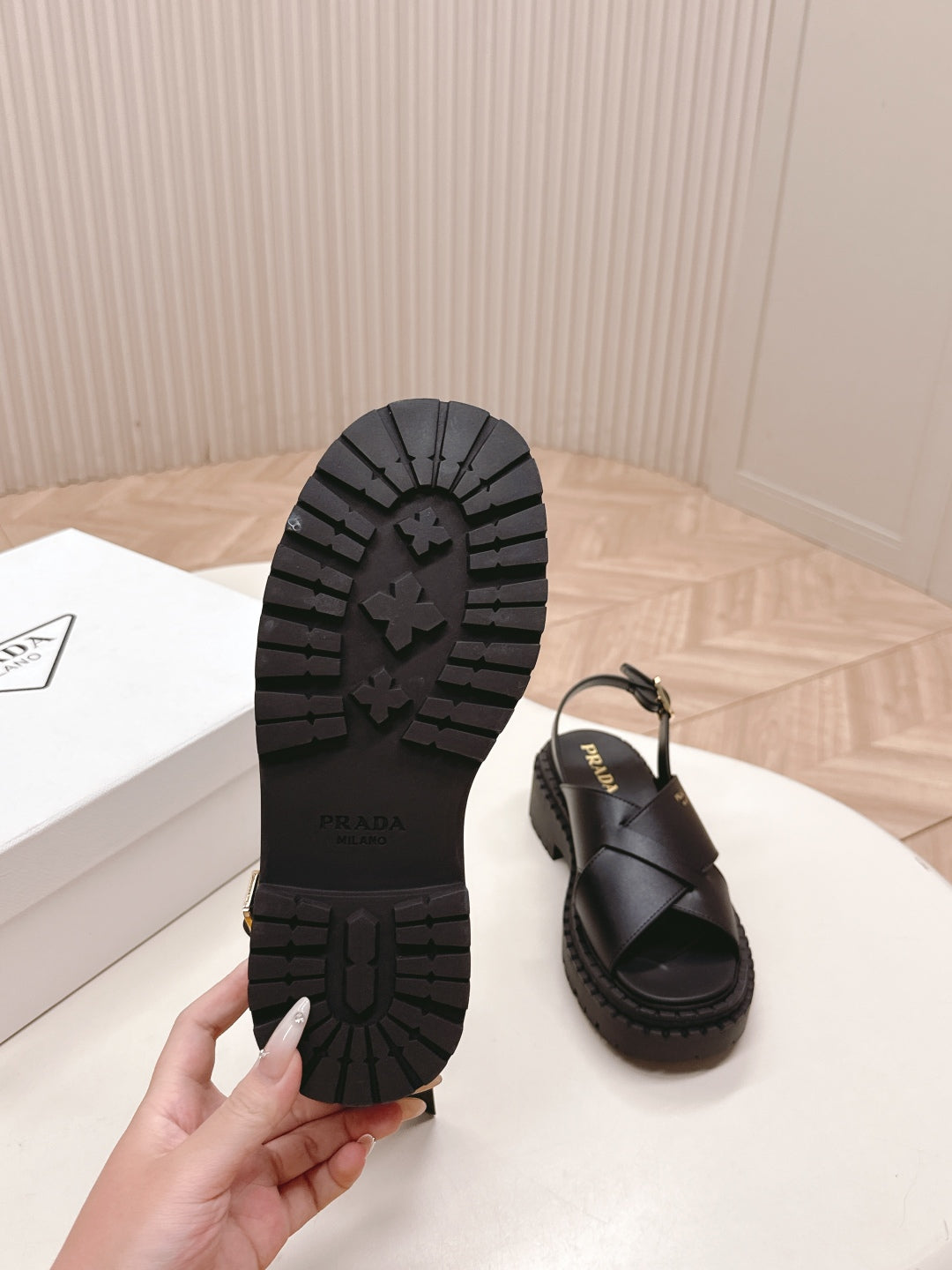 PRADA 25S CRISSCROSS SANDALS IN BLACK CALFSKIN