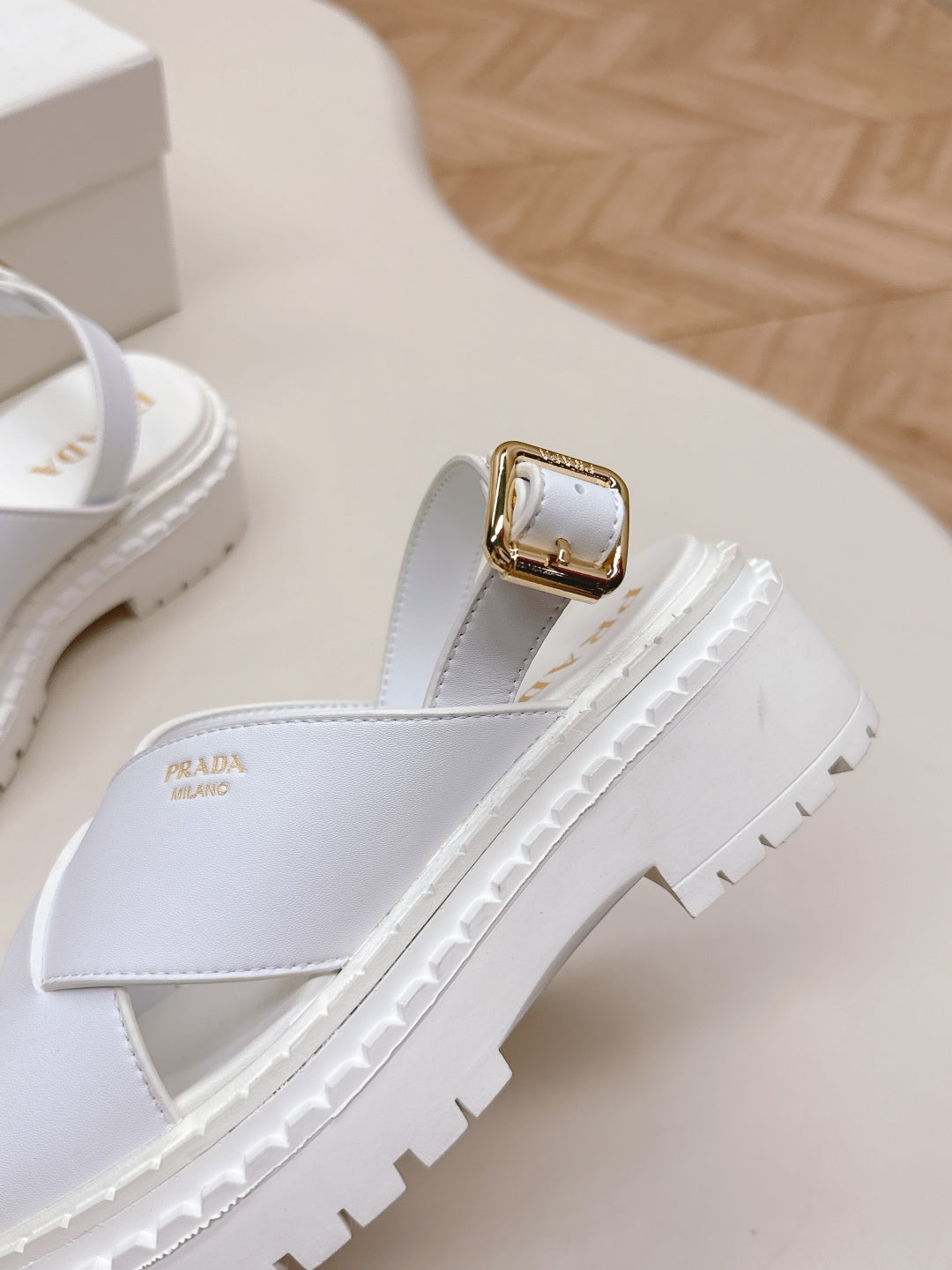 PRADA 25S CRISSCROSS SANDALS IN WHITE CALFSKIN